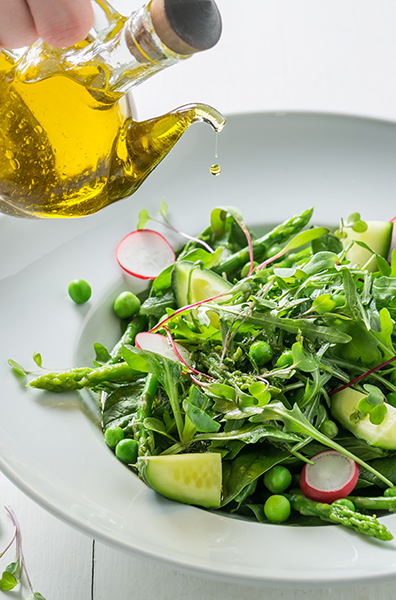 Spring vegetarian salad with spinach, radishes and asparagus okra fries